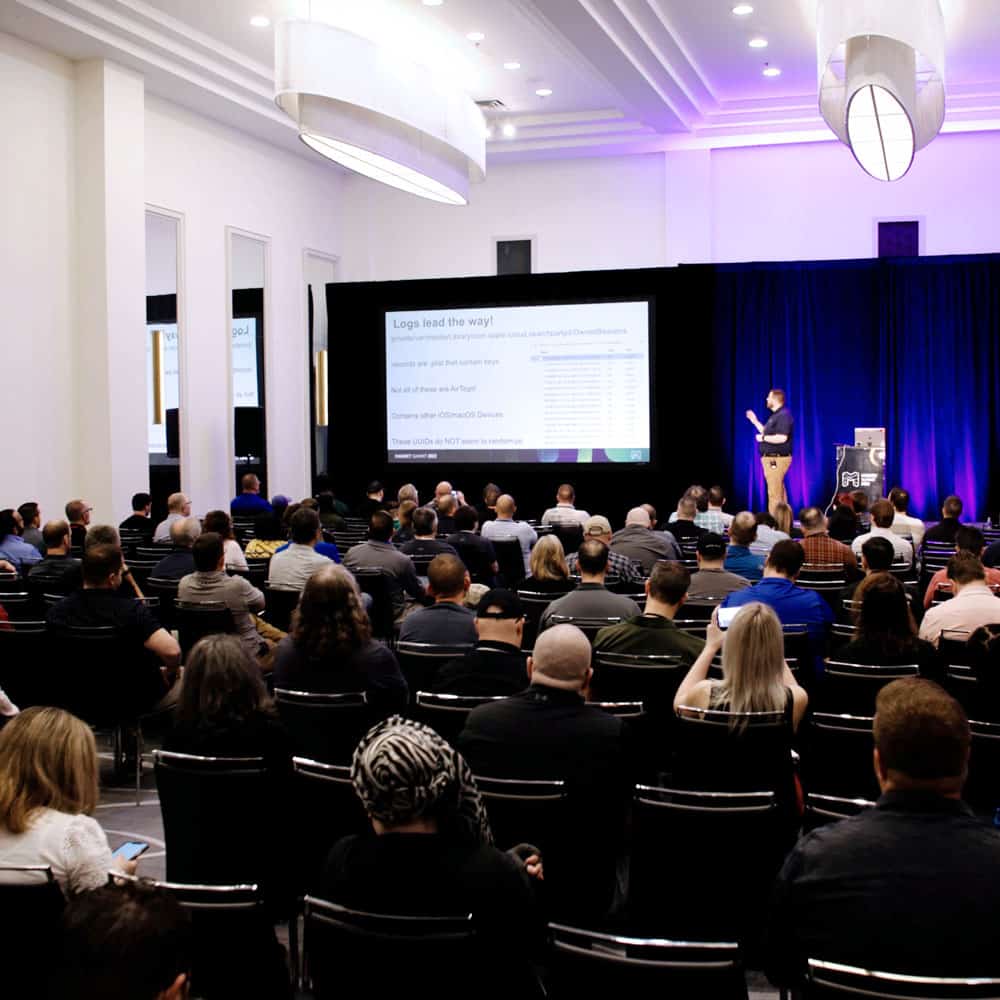 People watching presentation in large conference room